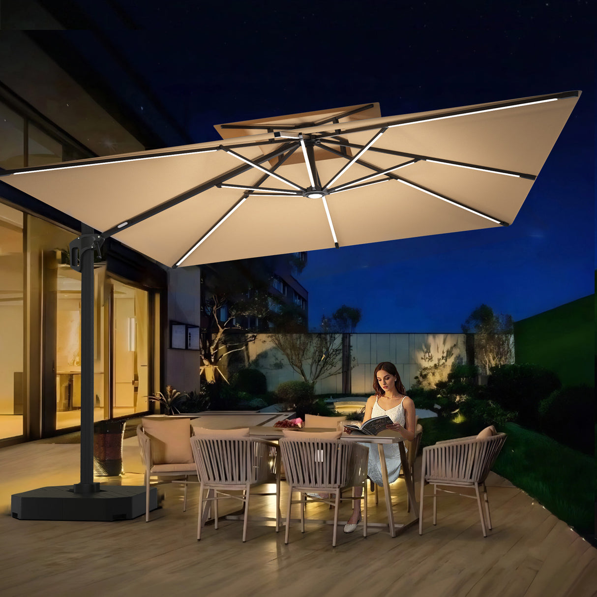 Patioslife 3×3m Tan Aegis Premium cantilever umbrella with LED strip lighting over evening patio dining set
