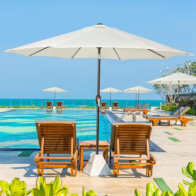 Patioslife Market Breeze creamy white patio umbrella beside pool loungers for resort style shade