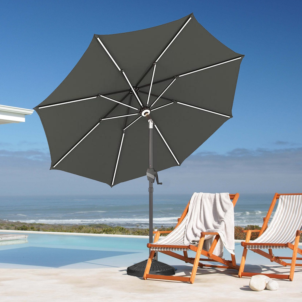 Patioslife Solara charcoal market umbrella with reinforced ribs on an ocean view poolside patio