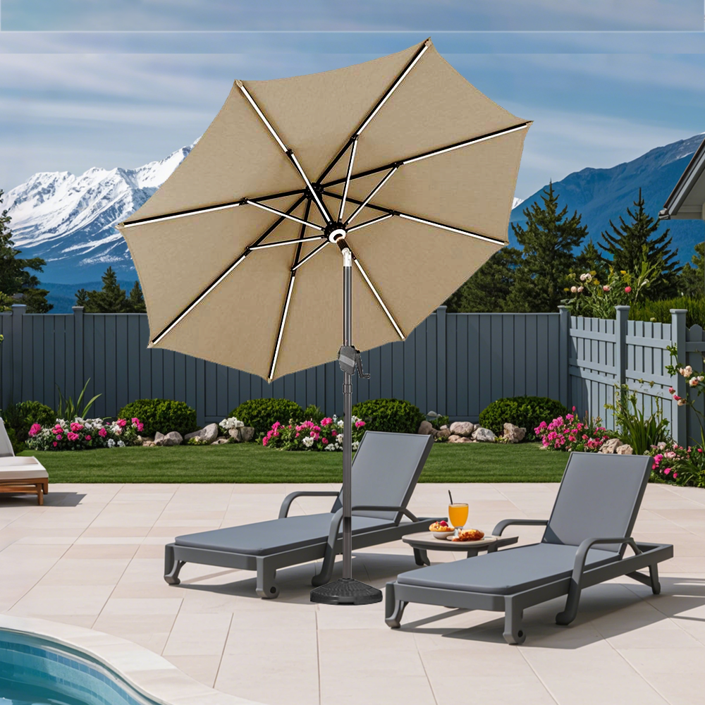Patioslife Solara tan market umbrella with reinforced aluminium frame beside pool loungers in a mountain garden setting