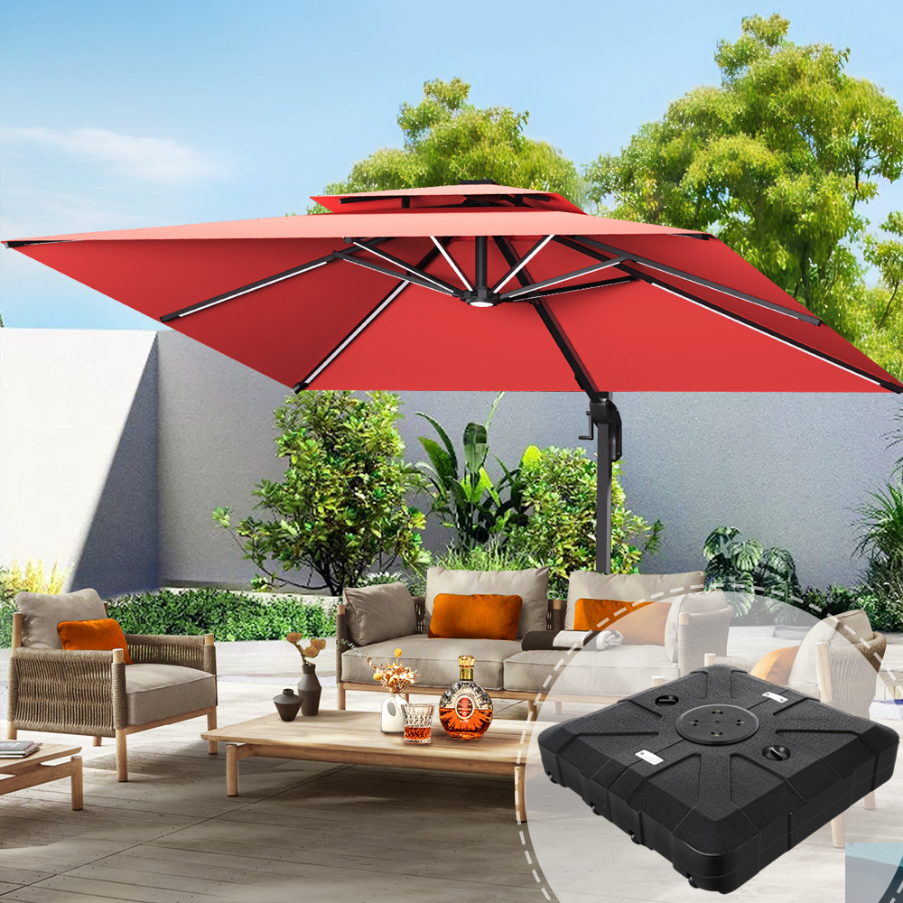Patioslife 3×3m Burgundy Aegis Premium cantilever umbrella with heavy-duty base highlighted in the corner, over a bright patio lounge setting with wicker chairs, sofa, wooden table and lush garden backdrop