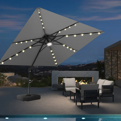 Patioslife 3x3m Charcoal LED cantilever umbrella lighting a poolside lounge area at night