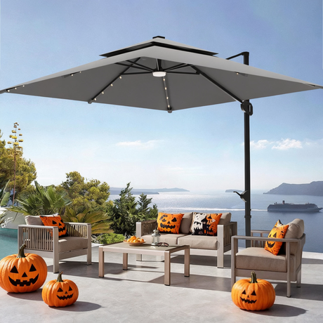 Patioslife 3x3m Charcoal LED cantilever umbrella over Halloween patio seating with sea view