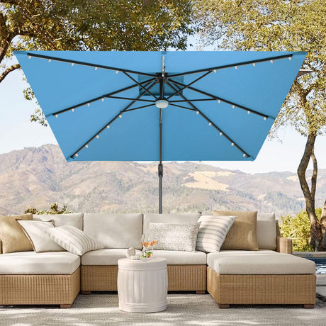 Patioslife 3x3m Turquoise LED cantilever umbrella over outdoor sofa with mountain garden view