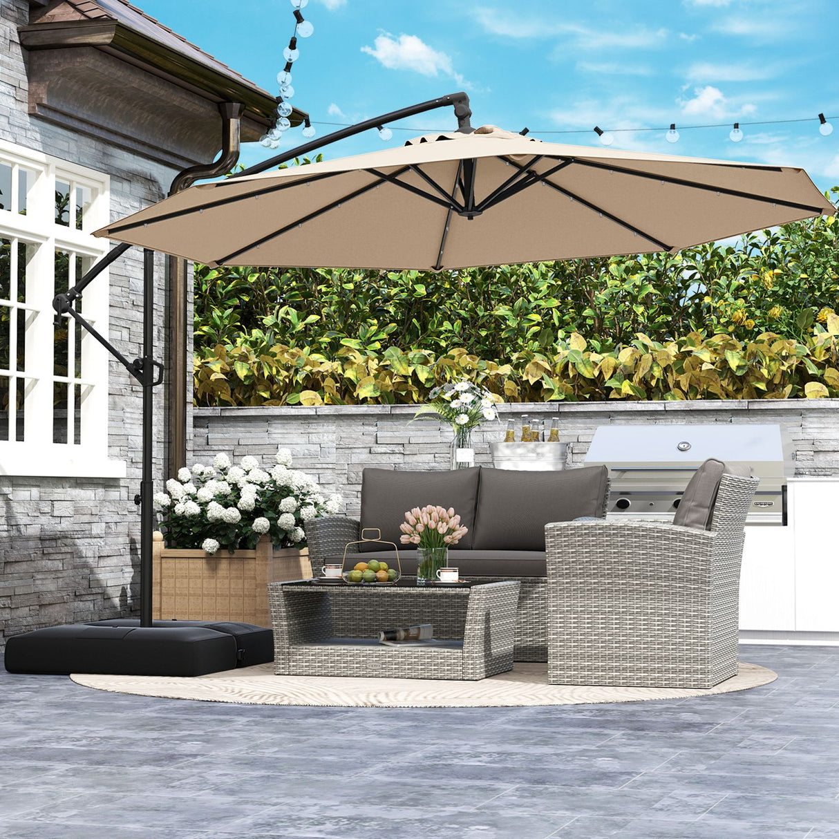 Patioslife Aegis Premium beige cantilever patio umbrella shading outdoor sofa and barbecue area in backyard