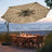 Patioslife Aegis Premium beige cantilever patio umbrella with solar LED lights over outdoor dining set by the beach