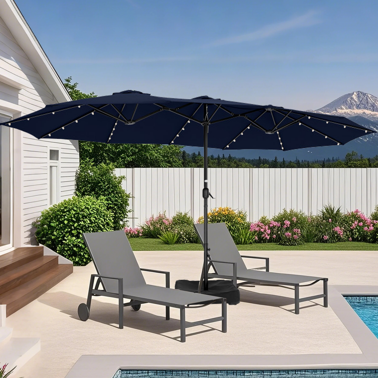 Patioslife Horizon Haven double-sided patio umbrella with base in black, 4.6 x 2.7m, with LED lights over two poolside loungers in a backyard