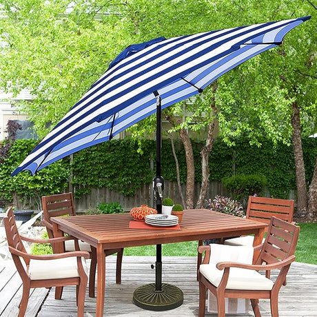 Patioslife Market Breeze blue and white striped outdoor umbrella over patio dining table