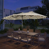 Patioslife Horizon Haven double-sided patio umbrella with base in cream, 4.6 x 2.7m, with LED lights over an outdoor dining set at night