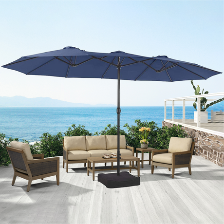 Patioslife Horizon Haven double-sided patio umbrella with base in navy blue, 4.6 x 2.7m, shading an outdoor seating set on a seaside deck