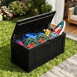 Black resin outdoor deck box storing pool supplies, garden hose and watering can, weatherproof patio storage solution