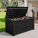 Outdoor deck box with open lid storing tools and equipment, large black resin weatherproof storage for patio and garden