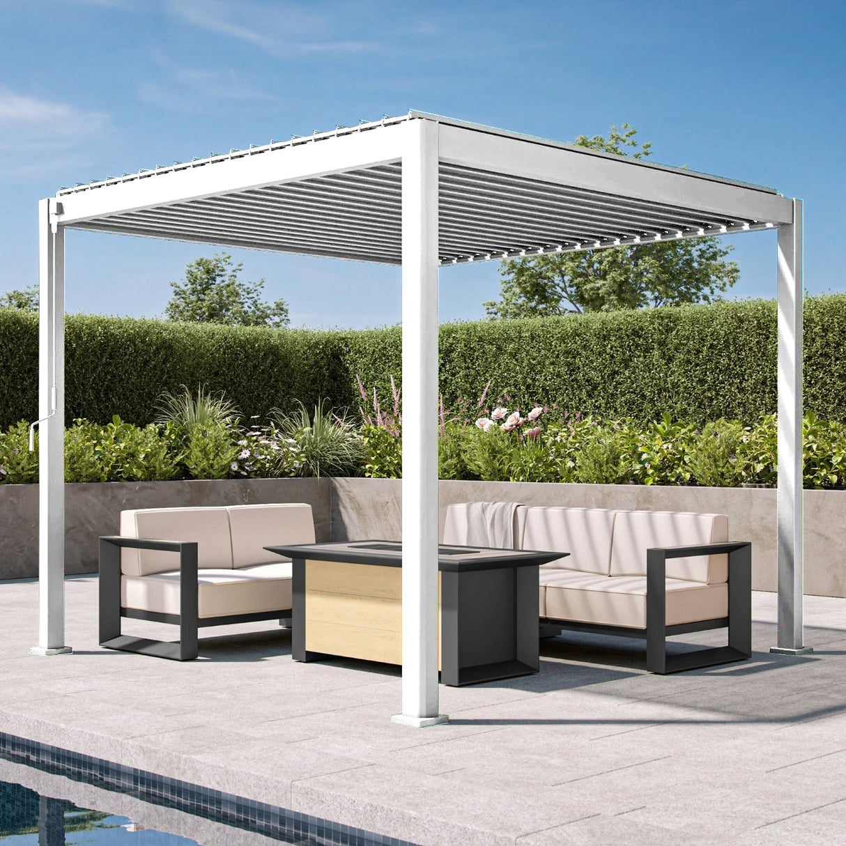Patioslife 3 x 3m white aluminium pergola with adjustable louvers over a modern poolside sofa set on a patio